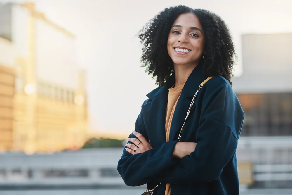 With the help of organic styling creams and a leave-in conditioner, she achieves a beautiful and defined s-shaped wave pattern on her textured hair.